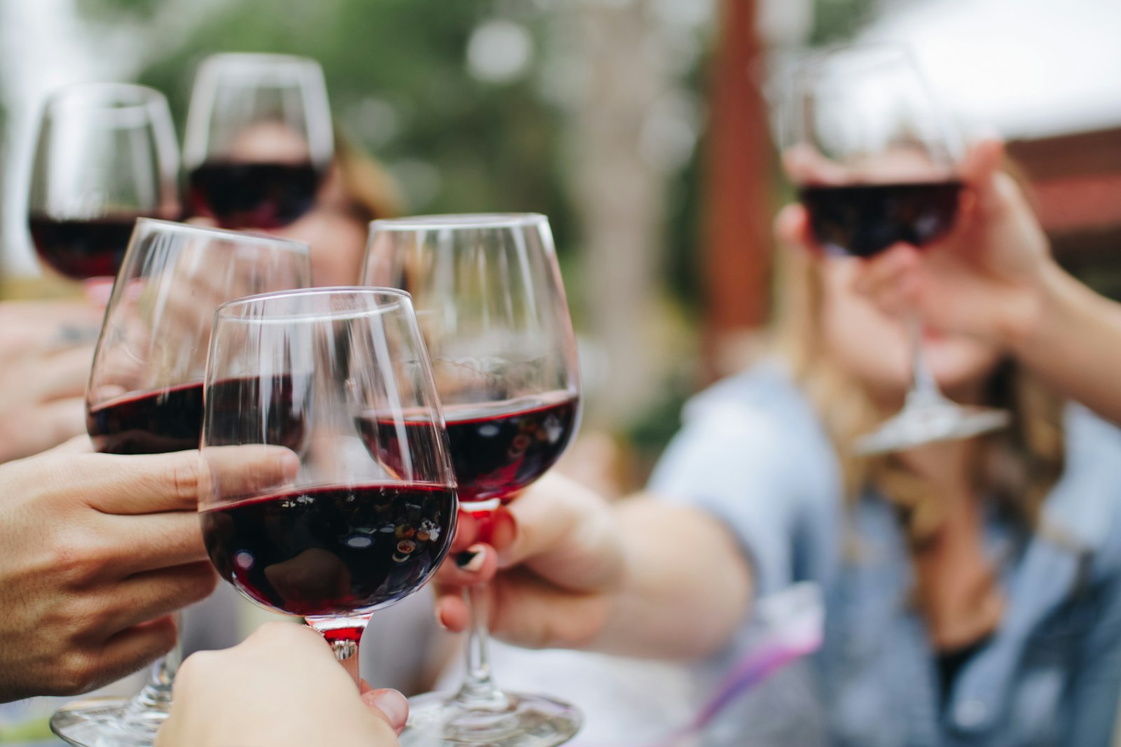 Wine glasses and a bottle on a wooden table