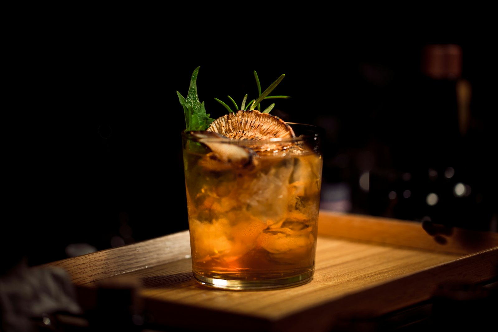 An amber cocktail in a coupe glass