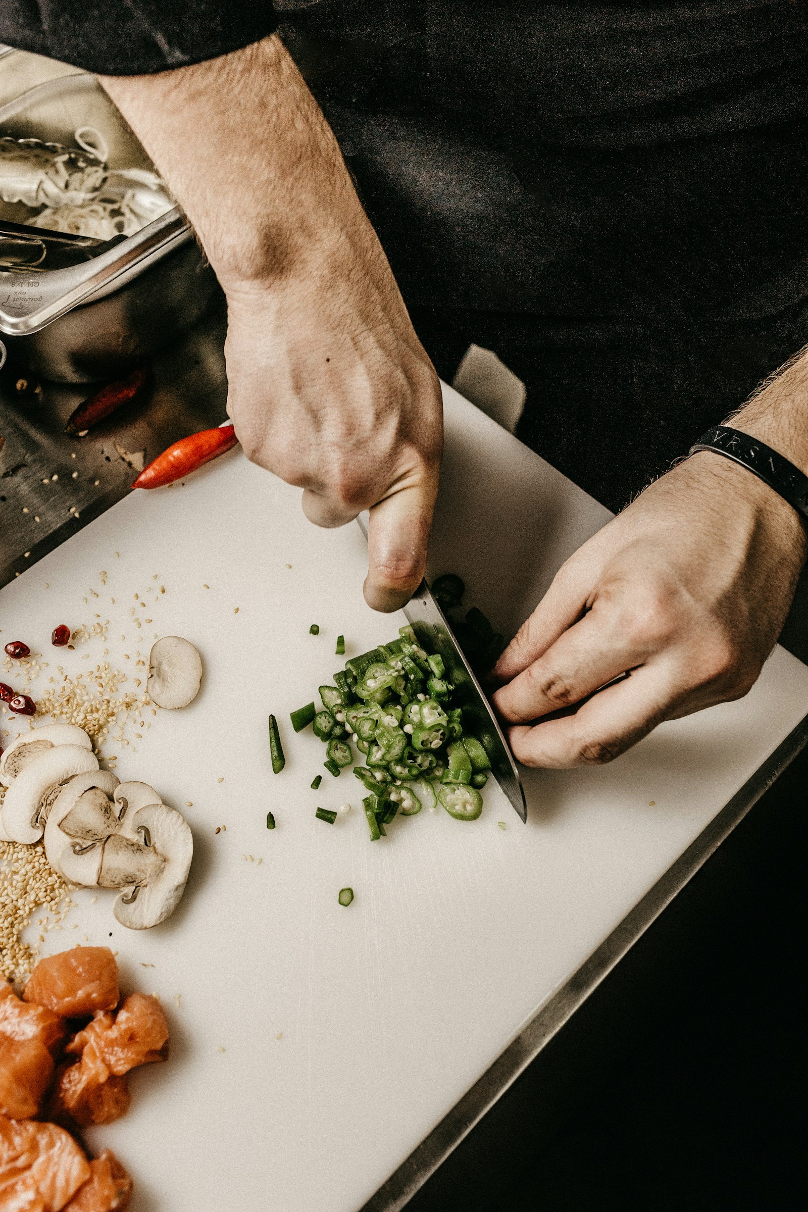 A chef plating a dish in a professional kitchen
